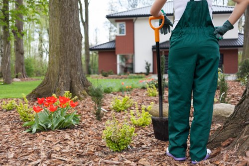 Front garden landscaping in Morden with neat paving and decorative borders